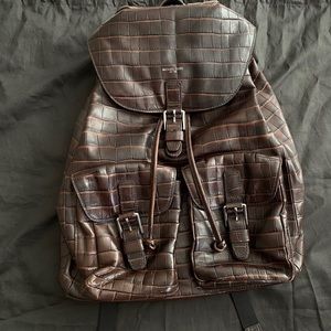 Micheal Kors embossed backpack.